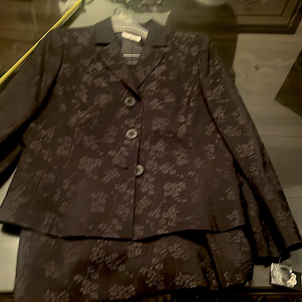 Gorgeous, 2 piece  black suit never worn. Elegant/beautiful, flower stitching.